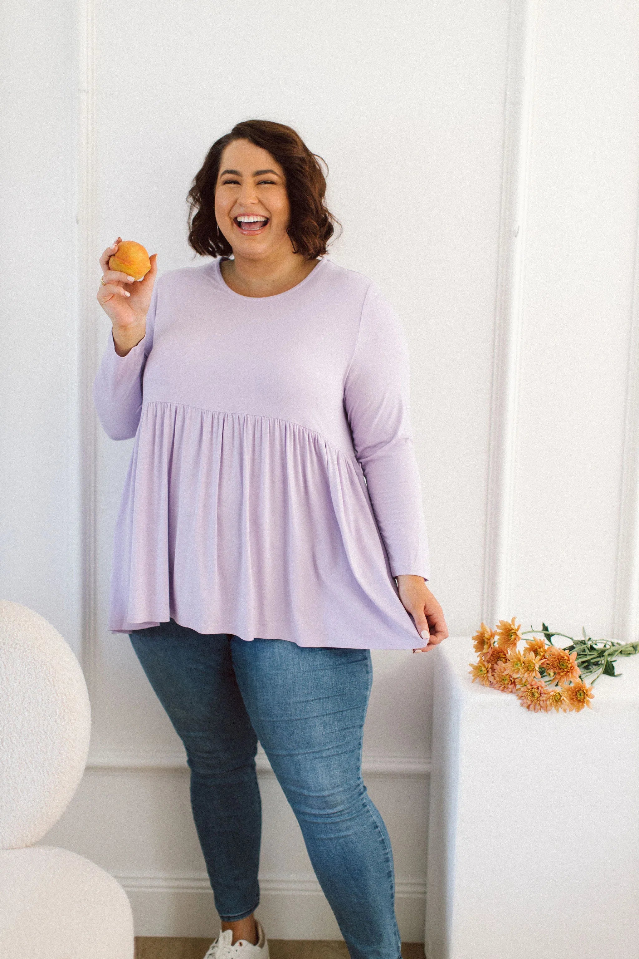 Plus Size clothing, women modeling a Womens Plus Size Tops, Lucy Long Sleeve Top in Purple Lilac