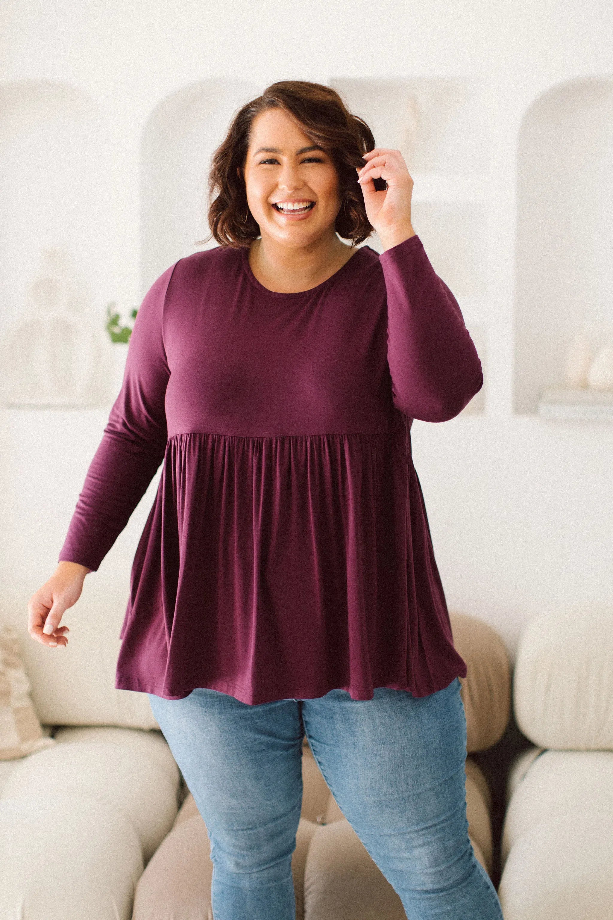 Plus Size clothing,  women modeling a Womens Plus Size Tops, Lucy Long Sleeve Top in Purple berry