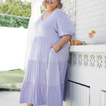 Model in stunning plus size dress - Harlow Dress in Purple Lilac by Peach The Label