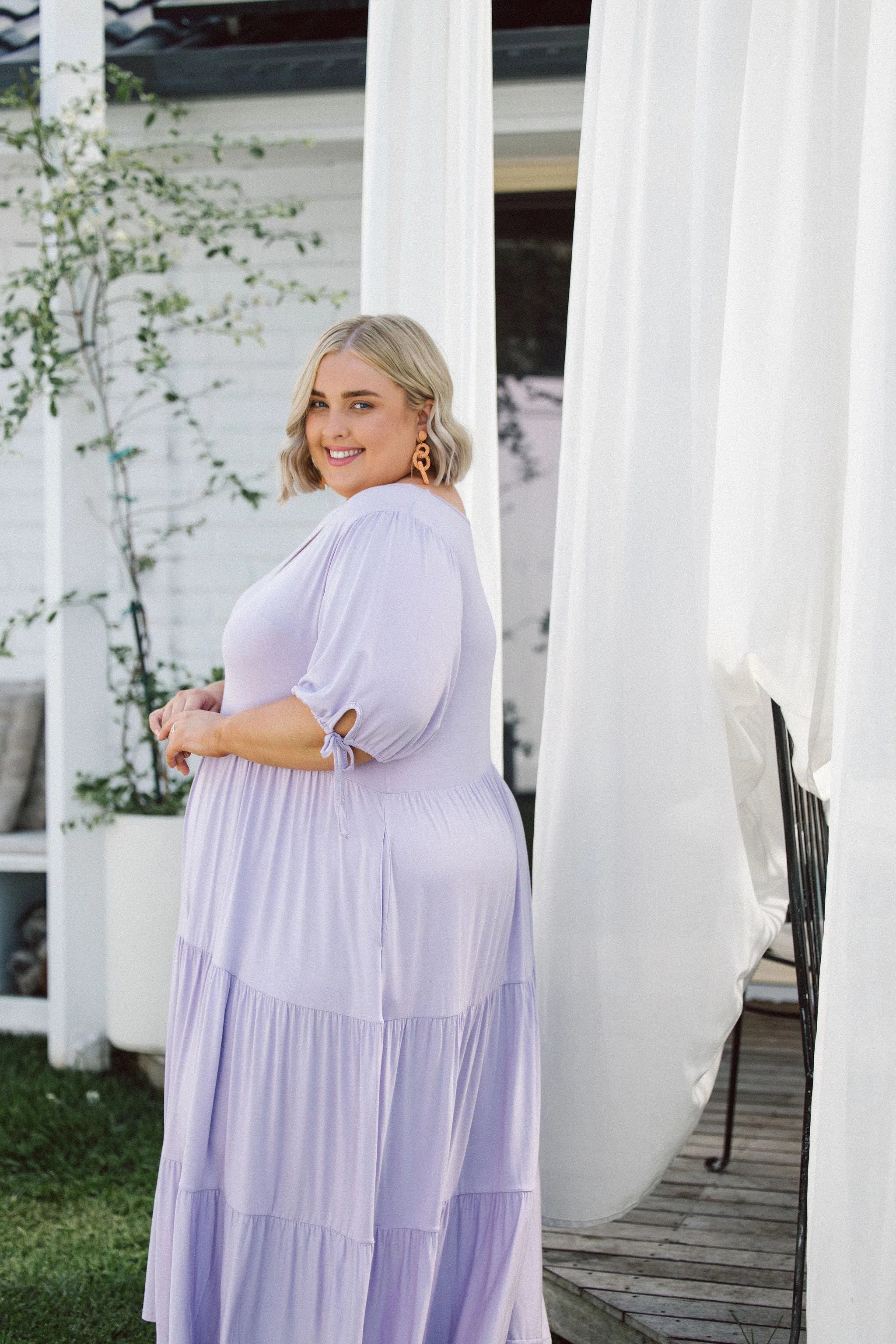 Model in Mesmerizing Plus Size Dress - Harlow Dress in Lilac